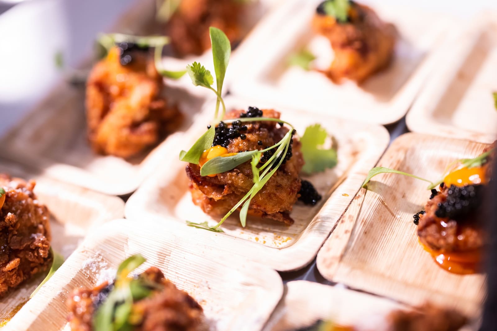Passed bites served on palm-leaf plates